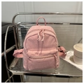 Detail of pink corduroy mini backpack with soft texture and front zipper pocket - Pink