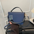 Navy blue woven chain crossbody bag for women featuring a gold geometric metal buckle - Blue