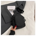 Detail of black nylon sling bag with dual zipper pockets and adjustable thick strap - Black