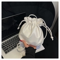 Chic white drawstring bucket bag with soft pleated texture and slim shoulder strap - White
