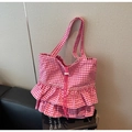 Pink and white checkered tote bag featuring stylish ruffled edges and drawstring closure - Pink