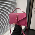 Modern magenta crossbody bag with golden buckle and sleek leather finish for women - Rose Pink