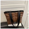 Brown quilted puffer tote bag with black strap handles in a minimalist modern design - Brown