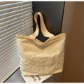 Minimalist beige canvas tote bag with heart embroidery and stylish shoulder straps - Yellow