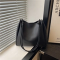 Minimalist black matte leather tote bag featuring elegant knotted dual shoulder straps - Black