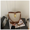 Minimalist beige canvas and brown leather bucket bag with gold twist lock and shoulder strap - Brown