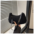 Classic black suede hobo shoulder bag with smooth synthetic leather strap in hand - Black