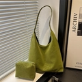 Green leopard pattern tote bag set with matching pouch in minimalist indoor setting - Green