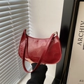 Glossy burgundy patent leather baguette shoulder bag with a sleek minimalist design - Red