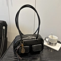Chic black leather handbag with dual straps and decorative tennis racket charm for women - Black With Pendant