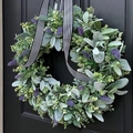 Artificial lavender wreath with green leaves and striped ribbon on a black wooden door - Flower Style 2