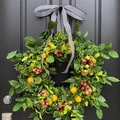 Artificial lavender and citrus wreath with black white bow on dark wooden door - Fruit Style 1