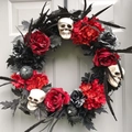 Halloween wreath with red roses, skulls and black pumpkins on a white door - Red & Black