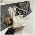 Detail of white leather drawstring bucket bag with silver chain handle and fashion text - With Pendant / White