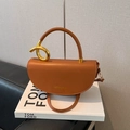 Brown semi-circular saddle bag with gold metal handle rings and adjustable shoulder strap - Brown
