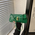 Emerald green patent leather baguette bag with a sleek gold capsule buckle for women - Green