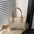 Boston bag with geometric triangle pattern and red edge trim on plush fabric - White