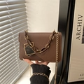 Vintage brown leather crossbody bag with dual decorative chains and metallic square clasp - Brown