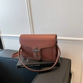 Brown crossbody bag with litchi texture, metal cross buckle and chain detail - Brown