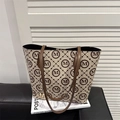 Beige tote bag with brown M-pattern print, leather handles and gold metal M charm - Khaki