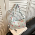 Borsa a spalla azzurra a fiori con tracolla arricciata e stampa di fiocco - Blu