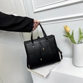 Minimalist black square crossbody bag with dual handles and gold-tone hardware detail - Black