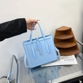 Chic light blue square crossbody bag with dual handles and drawstring detail - Blue