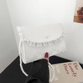 Close-up of floral lace crossbody bag featuring pearl clasp and elegant ruffle details - Pearl Style