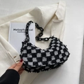 Chic black and white checkerboard tweed hobo bag with bold black acrylic chain strap - Black
