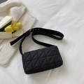 Black quilted puffer shoulder bag with geometric triangle stitching and adjustable strap - Black