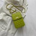 Quilted lime green crossbody bag with gold chain strap and elegant twist lock closure - Green