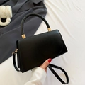 Minimalist black faux leather handbag with elegant gold buckle and shoulder strap - Black