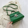 Emerald green crossbody handbag with golden metal twist lock and a single top handle - Green