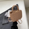 Khaki quilted crossbody bag with gold metal trim and elegant wave-cut top handle - Khaki
