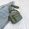 Dark green corduroy crossbody bag with adjustable canvas strap and front zip pocket - Green