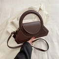 Dark brown geometric handbag with oversized round handle and adjustable shoulder strap - Brown