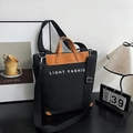 Grote zwarte canvas draagtas met bruine lederen rand en Light Fashion tekstprint - Zwart