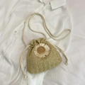 Beige woven straw bucket bag with white daisy flower detail and drawstring strap - Khaki