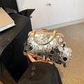 Pochette da sera con paillettes argento, cornice metallica oro e tracolla a catena - Argento