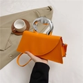 Chic orange leather crossbody bag with artistic silver metal handle and shoulder strap - Orange
