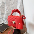 Red V-quilted handbag with gold heart buckle and ruffled handle with mini pouch - Red