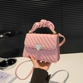 Pink quilted crossbody bag with silver heart lock and pleated handle details - Pink