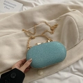 Bolso de noche ovalado azul claro con purpurina y asa dorada con cadena - Azul