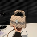 Beige quilted small square bag with silver heart buckle and ruffled handle detail - Khaki