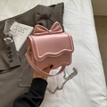 Pink fashion crossbody bag with large bow and wave-edge flap in premium PU leather - Pink