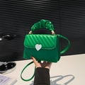 Emerald green crossbody bag with quilted stripes and heart buckle in PU leather - Green