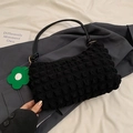 Minimalist black tote bag with bubble texture and green flower charm detail - Black