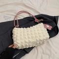 Minimalist waffle textured shoulder bag in cream white with pink cord straps and flower charm - White and Pink