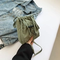 Minimalist light green nylon bucket bag with drawstring closure and front pocket - Green
