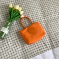 Mini orange nylon handbag with heart smile patch and matching tubular handles - Orange